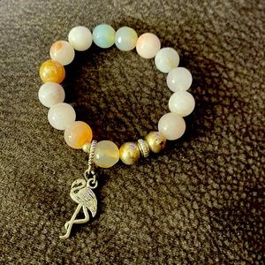 a cute bracelet with a flamingo charm 😊